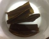 A picture of step 2 of Golden Dashi Stock with Konbu and Bonito Flakes.