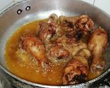 A picture of step 3 of Honey and ketchup glanced chicken drumsticks.