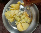 A picture of step 1 of Aloo pitika.