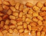 A picture of step 11 of Taisen's chili cheese hot dog w/tots.