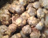 A picture of step 4 of Cheesy sausageball onion casserole.