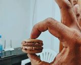 A picture of step 7 of Chocolate Macaroons with Chocolate Ganache.