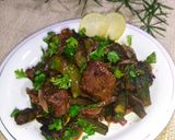 A picture of step 11 of Bhindi Gosht (okra).