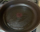 A picture of step 4 of Salt-Grilled Saba with frying pan.