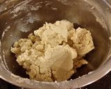 A picture of step 5 of Toasted Coconut Thumbprint Cookies.
