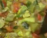 A picture of step 5 of Turaii (Ridge gourd) with kalonji and curry leaf.