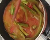 A picture of step 2 of Snakegourd and drumstick theeyal.