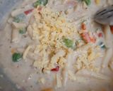 A picture of step 6 of Cheesy and Creamy veggie white sauce penne pasta (with fresh cream, cheese and seasonings).