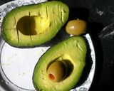 A picture of step 2 of Avocado w/ olive juice.