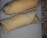 A picture of step 3 of Brat/hot dog cheesy egg rolls.