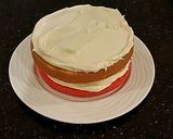 A picture of step 12 of Vanilla Christmas Layer Cake with Creamy Vanilla Buttercream Frosting.