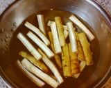 A picture of step 2 of For the New Year's Feast: Burdock Roots with Cashew Nuts.
