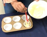 A picture of step 6 of NUTELLA SWIRL MUFFINS eggless.