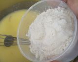A picture of step 3 of Eggless mawa cup cake topping with shrikhand.