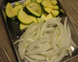 A picture of step 1 of Zucchini and Sweet Onion Early Summer Miso Soup.