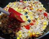 A picture of step 7 of Thai style fried rice with vegetables and tofu.
