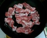 A picture of step 4 of Juicy Pan-Fried Pork with Ginger.