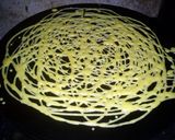 A picture of step 4 of Roti Jala (Net Like Bread).