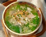 Hình bước làm 3 của món Canh cải xoăn và nấm nấu cá