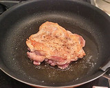 A picture of step 12 of Authentic Garlic Chicken in a Frying Pan.