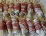 A picture of step 3 of Japanese-style Enoki Mushrooms and Hanpen Fish Cake Wrapped with Sliced Pork.