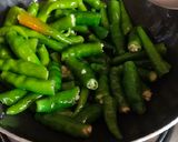 A picture of step 2 of Green chilli Thecha.