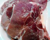 A picture of step 2 of Garlic & Herb Fried Pork Chops.