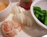 A picture of step 2 of Sweet Onion and Snow Peas with Fluffy Scrambled Eggs.