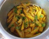 A picture of step 7 of Dry potatoe curry#cookingwith Tomatoescontest.