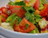 A picture of step 6 of Octopus, Avocado, and Tomato Salad with Cilantro.