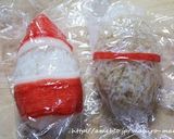 A picture of step 4 of Christmas Character Bento with Santa Claus and a Reindeer.