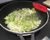 A picture of step 1 of Crustless Leek Quiche with blue cheese and chillies.