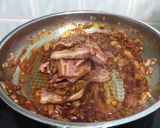 A picture of step 2 of Bacon And Onion In BBQ Sauce Open Sandwich.