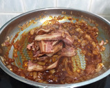 A picture of step 2 of Bacon And Onion In BBQ Sauce Open Sandwich.