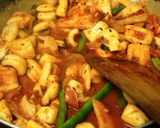 A picture of step 5 of Squid cubes and beans stir fry in kerala spicy-roast coating.