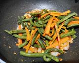 A picture of step 3 of Schewan beans and carrot stir fry.