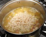 A picture of step 5 of Porotos con Riendas with Smoked Ham.