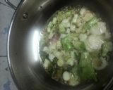 A picture of step 3 of Baingan bharta with green peas.