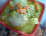 A picture of step 7 of Rosgolla naboratan korma.