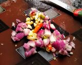A picture of step 1 of Kakharu Phula Bhaja Pumpkin flower masala fry.