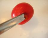 A picture of step 2 of How to Pit Cherries.