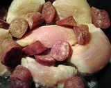 A picture of step 2 of chicken and sausage in duck sauce.