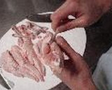 A picture of step 2 of Chicken Wing Gyoza (with chicken de-boning instructions).