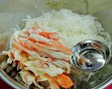 A picture of step 5 of Simple Daikon Radish & Crab Stick Salad.