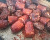 A picture of step 13 of Meat balls and beef sausages bitings in sauce.
