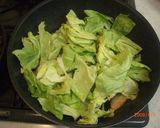A picture of step 4 of Pn-Fried and Steamed Salmon and Cabbage.