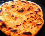 A picture of step 16 of Sarso ka saag with makki roti.