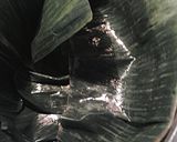 A picture of step 2 of Potatoes and carrots roasted in banana leaf.