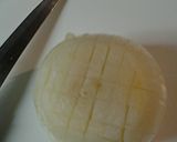 A picture of step 2 of One way to chop an onion.