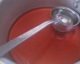 A picture of step 4 of Street style water melon with red juice.